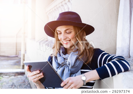Attractive young female tourist chatting with 29297374