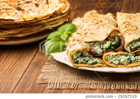 Pancakes filled with spinach and cheese Pancakes filled with spinach and cheese 29297519