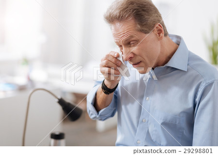 Sick male person wrinkling his forehead Sick male person wrinkling his forehead 29298801