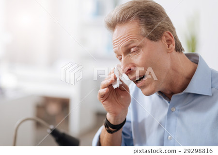 Crying man wiping his tears Crying man wiping his tears 29298816