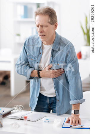 Inert worker putting his hand on the heart 29299261