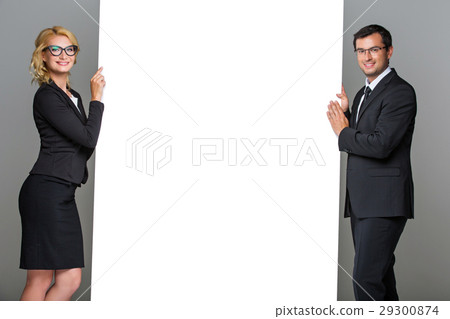 Businessman and business woman with big empty 29300874