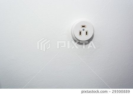 Male hand puts plug in the socket 29300889