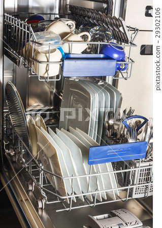 Dishwasher with white plates and steel cutlery 29302106