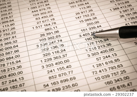 showing a diagram on a financial report using pen 29302237