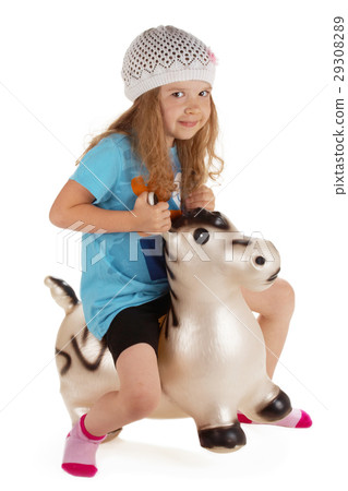 adorable little girl with toy donkey 29308289