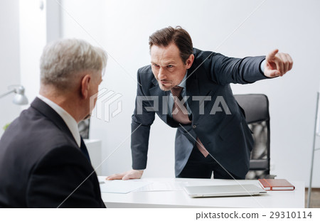 Severe boss discharging employee from the office 29310114