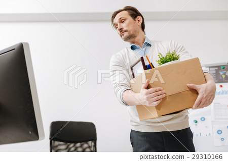 Fired employee carrying the box and leaving the 29310166