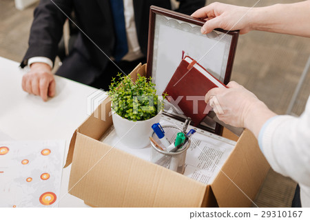 Fired employee packing the box and quitting the Fired employee packing the box and quitting the 29310167