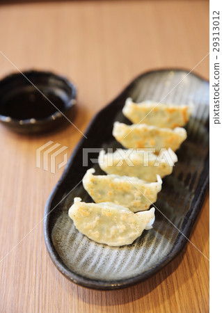 gyoza on wood background 29313012