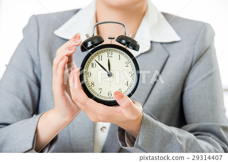 business woman holding clock business woman holding clock 29314407