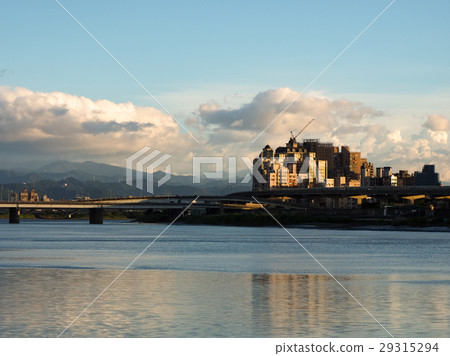 Riverbank in the sunset 29315294