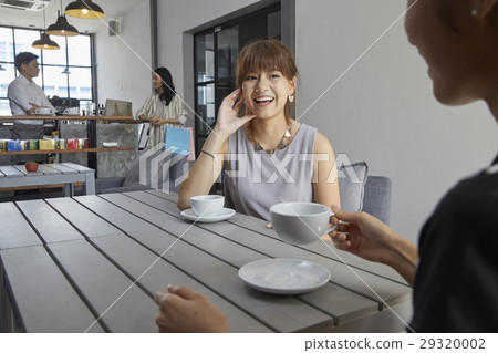 Portrait of pretty women having coffee break in office. Portrait of pretty women having coffee break in office. 29320002