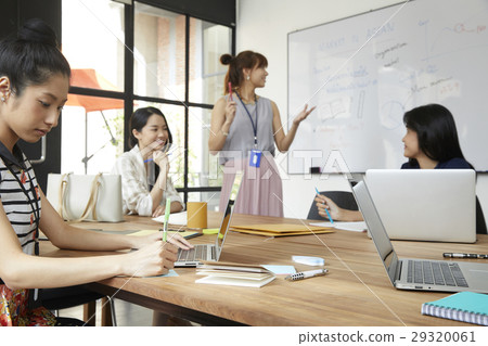 Young colleagues are discussing new business ideas in office. Young colleagues are discussing new business ideas in office. 29320061