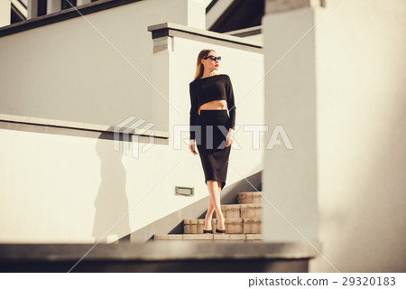 fashion outdoor photo of beautiful ladylike woman with long hair 29320183