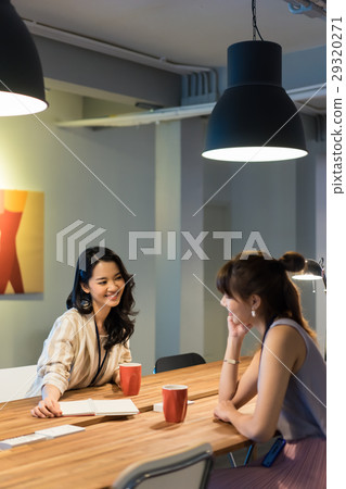 two female colleagues are working in modern office two female colleagues are working in modern office 29320271