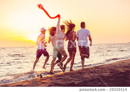 Group of happy young people is running on 29320314