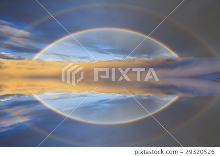 Reflection of a rainbow in calm water Reflection of a rainbow in calm water 29320526