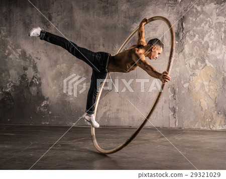Circus artist in aCyr Wheel Circus artist in aCyr Wheel 29321029