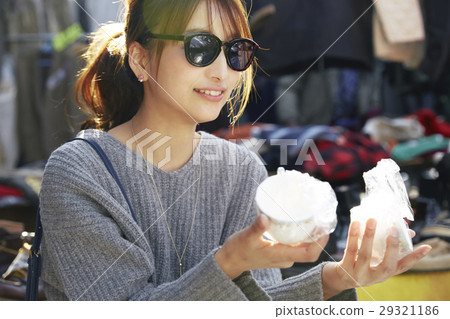 A woman enjoying a flea market A woman enjoying a flea market 29321186