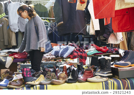 A woman enjoying a flea market A woman enjoying a flea market 29321243