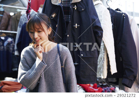 A woman enjoying a flea market A woman enjoying a flea market 29321272
