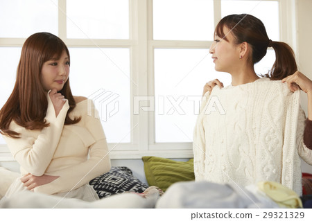 Women enjoying online auction Women enjoying online auction 29321329