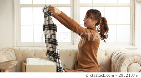 A woman enjoying a net auction 29321379