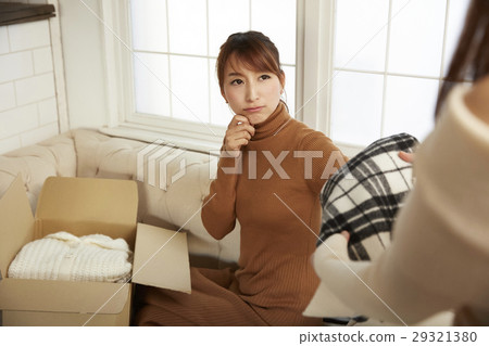 Women enjoying online auction Women enjoying online auction 29321380