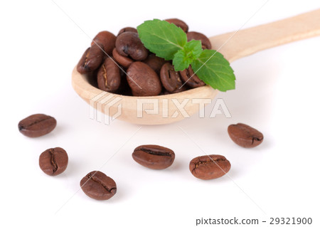 Coffee beans in a wooden spoon with leaf isolated 29321900