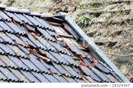 Broken roof of an abandoned farm 29324347