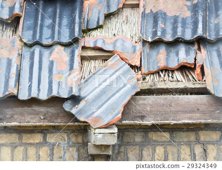 Broken roof of an abandoned farm Broken roof of an abandoned farm 29324349