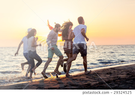 Group of happy young people is running on 29324525
