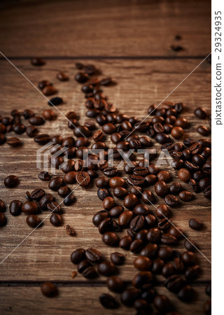 Black coffee beans on a wooden table 29324935