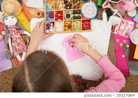 girl sews doll clothes top view sewing accessories 29327064