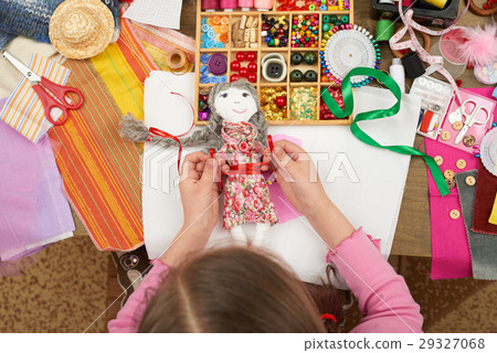 girl sews doll clothes top view sewing accessories 29327068