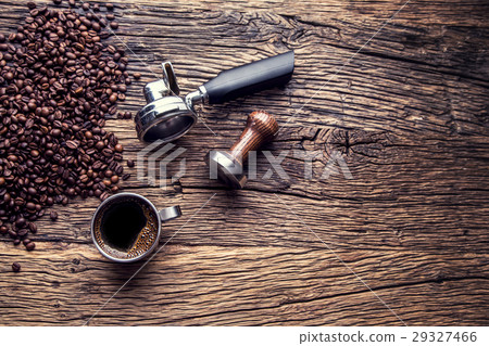 Black coffee with coffee beans and portafilter. 29327466
