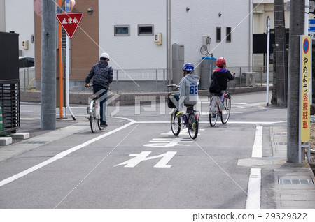Children playing on a bicycle Children playing on a bicycle 29329822