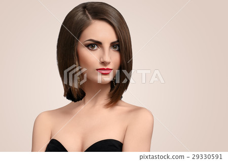 Beautiful elegant young woman posing in studio  29330591