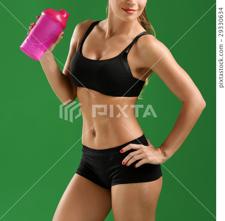 Attractive young fitness woman with a sports Attractive young fitness woman with a sports 29330634