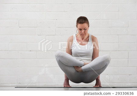 Young flexible woman doing advanced yoga asana. Young flexible woman doing advanced yoga asana. 29330636