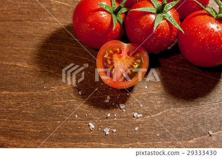 fresh ripe cherry tomatoes on wooden background fresh ripe cherry tomatoes on wooden background 29333430