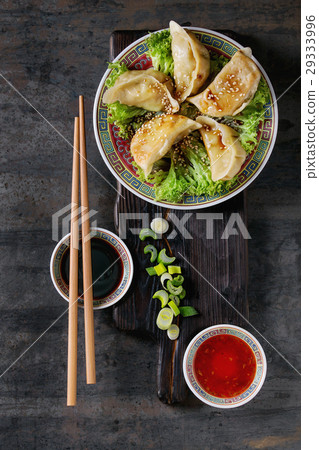 Gyozas potstickers with sauces 29333996