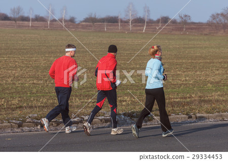 Three runners while training for a competition 29334453