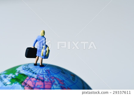 miniature traveler woman on the globe 29337611