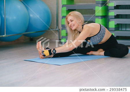 Fitness girl stretching yoga gym Fitness girl stretching yoga gym 29338475