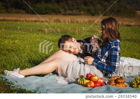 Woman hugging guy. they drinking wine picnic in 29338540