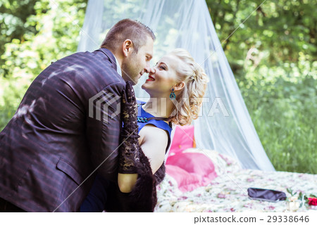 A couple by bed in meadow A couple by bed in meadow 29338646