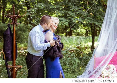 A couple by bed in meadow A couple by bed in meadow 29338683