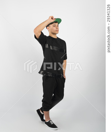 Young muscular man in black clothes and sneakers 29341326